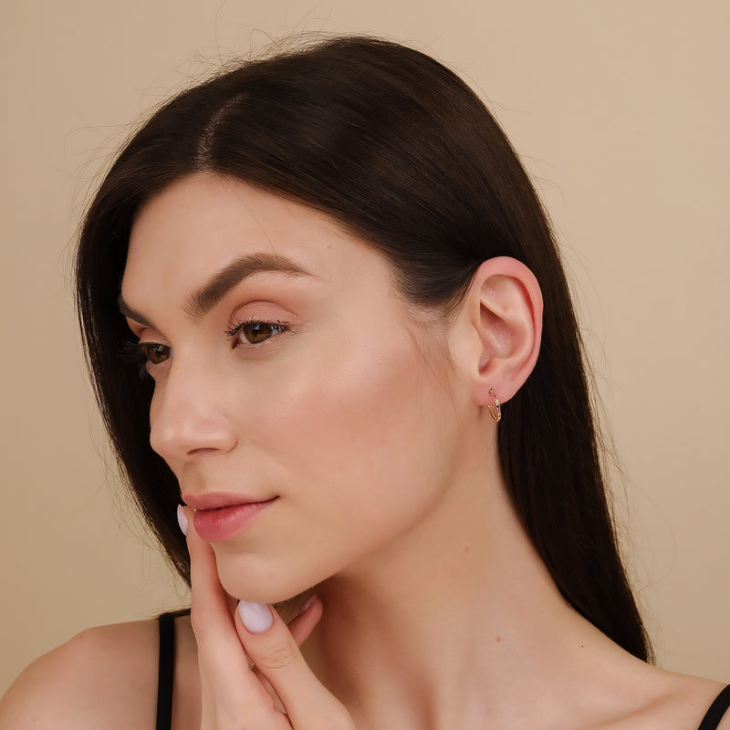 model wears dainty thing rainbow sapphire hoop earrings