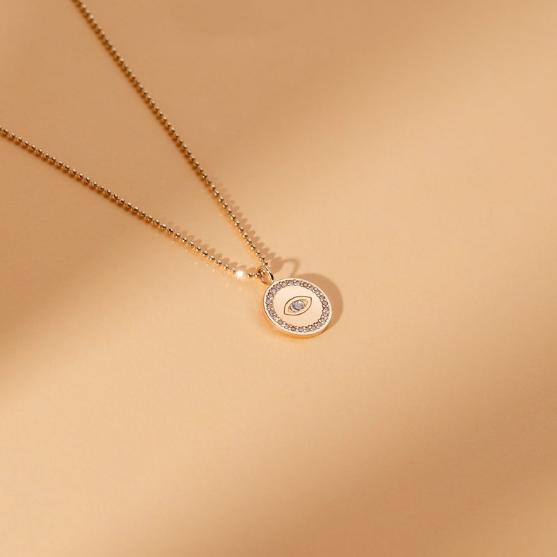 simplistic round eye pendant with lined diamonds for her