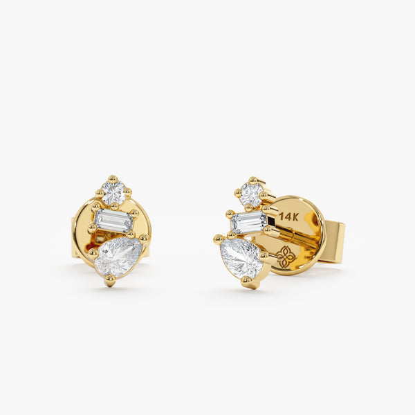 Handmade pair of solid 14k gold stud earrings with multiple diamond cluster