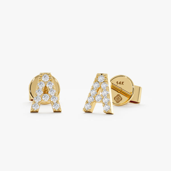 handmade pair of solid 14k gold diamond lined capital letter stud earrings