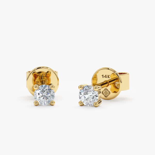 Classic pair of 4 prong diamond set earring studs in 14k solid gold 