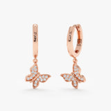 Pair of butterfly shape charm huggies in butterfly shape with natural diamonds in 14k rose gold 