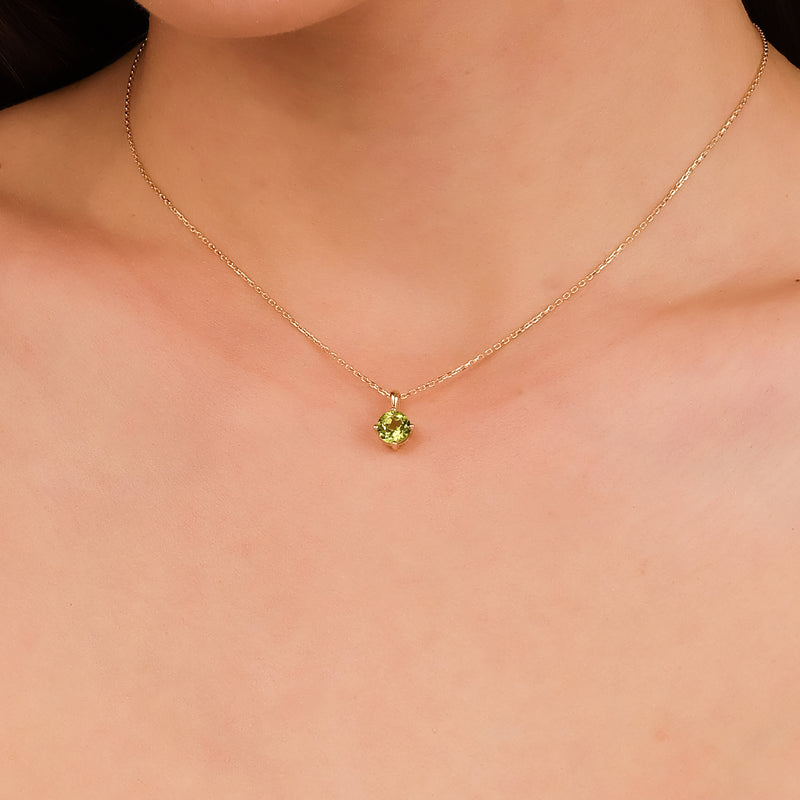 14k gold necklace with peridot gemstone in four-prong setting