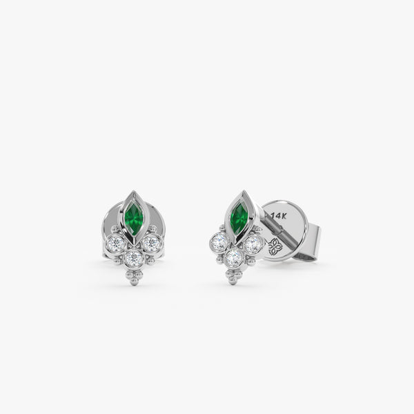 Pair of handcrafted 14k solid white gold earring studs with marquise emerald and 3 bezel set diamonds