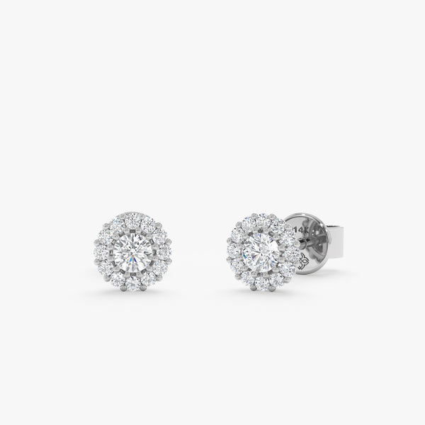 Pair of handcrafted 14k solid white gold stud earrings with diamonds 