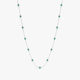 Luxurious emerald and white gold station necklace