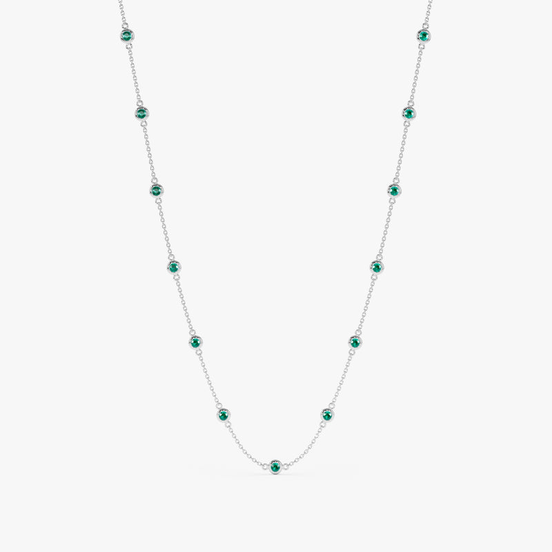 Luxurious emerald and white gold station necklace