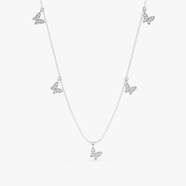 solid white gold necklace with multiple diamond paved butterfly charms