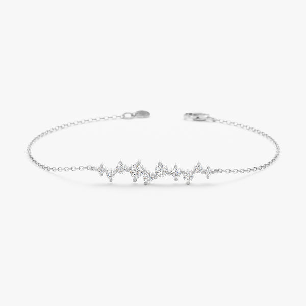 Natural diamond bracelet with dainty clusters on a white gold chain.