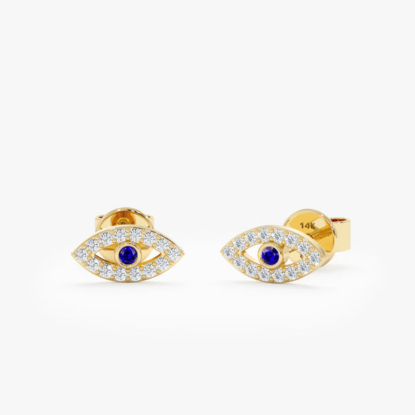 handmade pair of solid 14k gold natural diamond lined eye shape stud earrings with natural blue sapphire