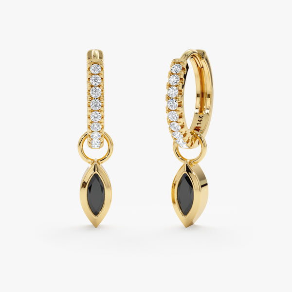 Pair of black marquise diamond charm huggie earrings lined in natural diamonds. 