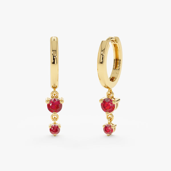 Pair of solid 14k gold huggie earrings with drop down double rubies