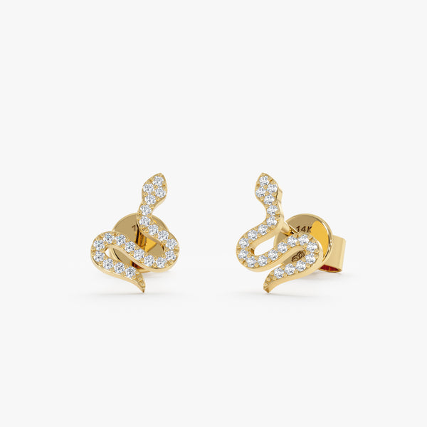 Pair of handmade solid 14k yellow gold snake stud earrings with natural white diamonds