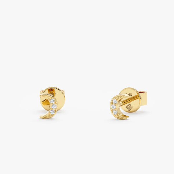handmade pair of solid 14k gold moon studs with paved diamonds