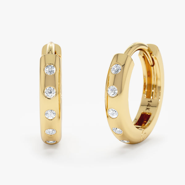 Handmade pair of solid 14k gold flush set diamonds 