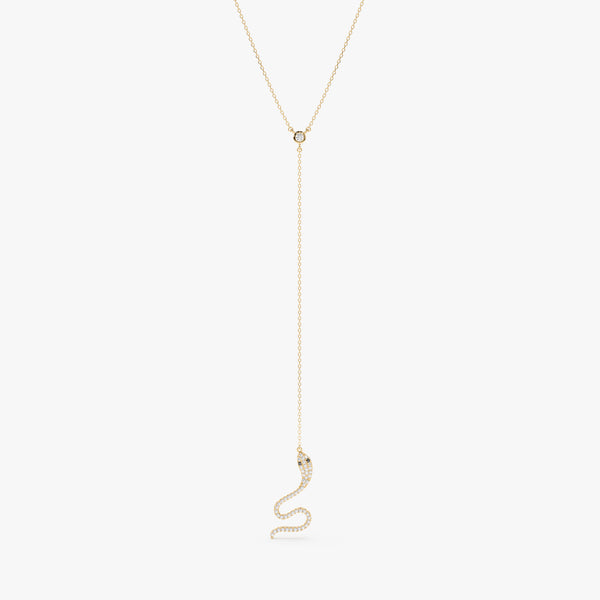 Solid gold lariat necklace featuring a diamond-studded snake pendant.