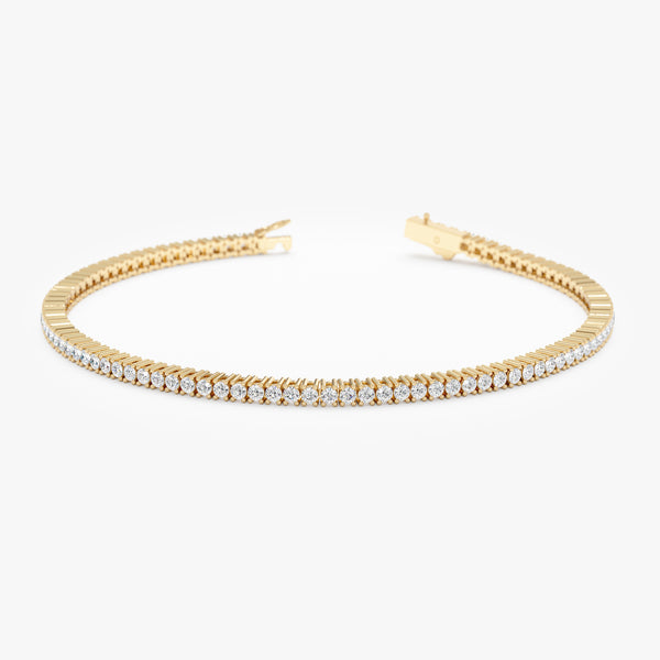 Diamond eternity bracelet crafted in solid gold.