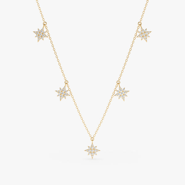 handmade solid gold dainty necklace with multiple starburst hanging charms with paved diamonds