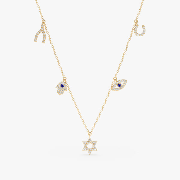 solid gold necklace with horseshoe charm, wishbone, hamsa hand, eye and star of david protective charms in lined diamonds with blue sapphire