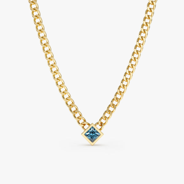 solid 14k yellow gold miami chain with blue topaz