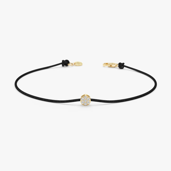 dainty black string bracelet with diamond disc charm in yellow gold
