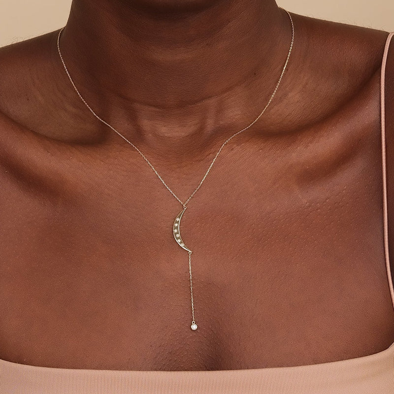 dainty yellow gold crescent moon drop necklace with natural diamonds