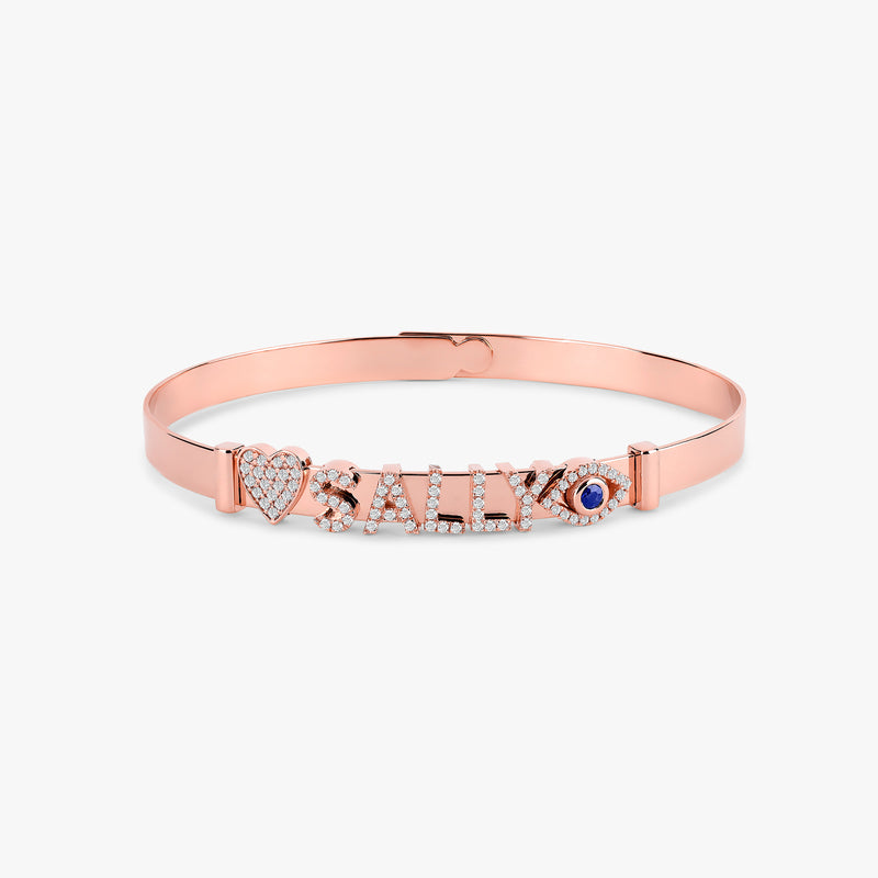 Sleek rose gold bangle designed for a variety of decorative charm options.