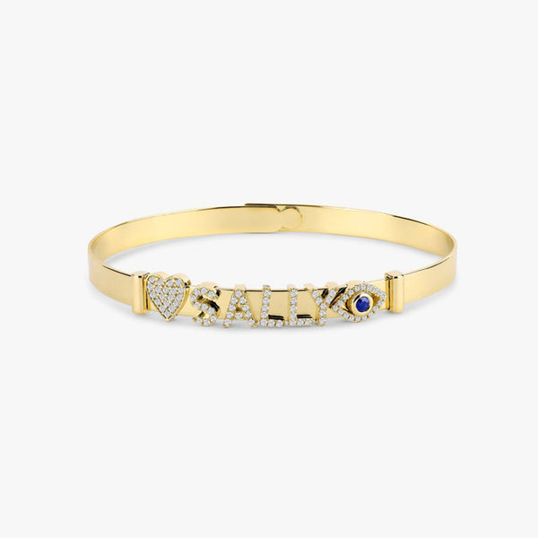 Solid gold bangle bracelet with customizable charms.