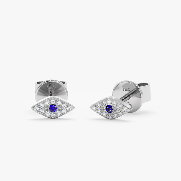 Handcrafted pair of flat eye shape earring studs in solid 14k white gold with blue sapphire