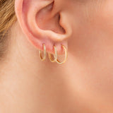 Model wears Handmade Yellow 14k solid Gold hoop earrings