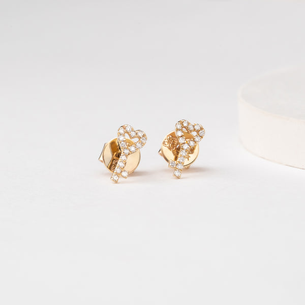 Handmade pair of 14k solid gold earring studs in heart and key diamonds