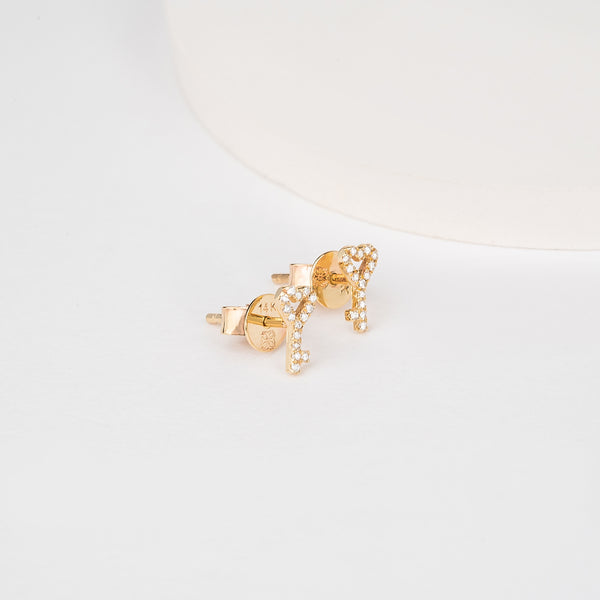 Pair of solid 14k gold stud earrings in key and heart shape