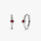 Handcrafted pair of 14k solid white gold huggie hoops with red garnet bezel