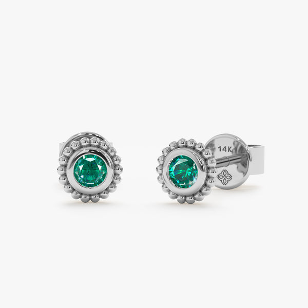 Pair of solid 14k white gold art deco style emerald stud earrings