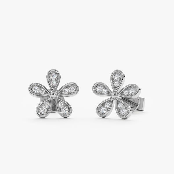 handcrafted pair of solid white gold flower stud earrings with five petals with diamonds