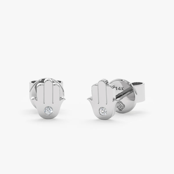 handcrafted pair of solid 14k white gold stud earrings with single diamond