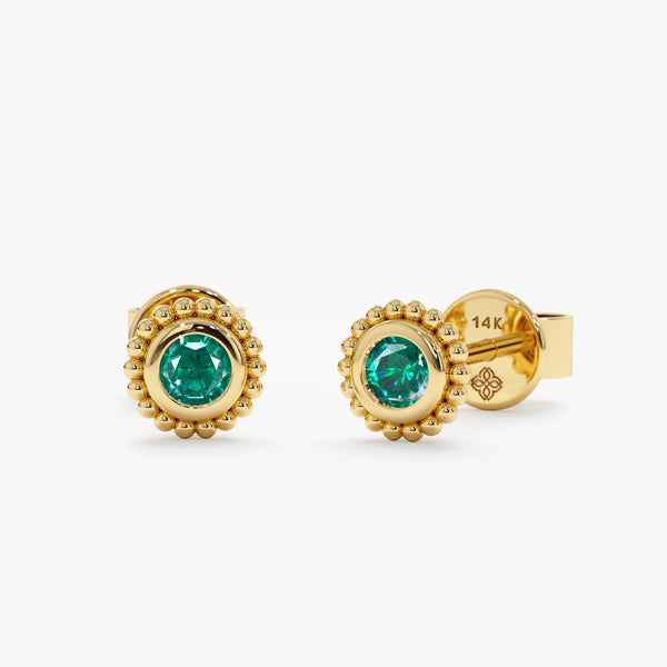 Pair of solid 14k gold art deco style bezel emerald stud earrings