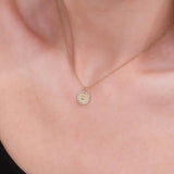 dainty circular eye pendant with natural diamonds in solid gold