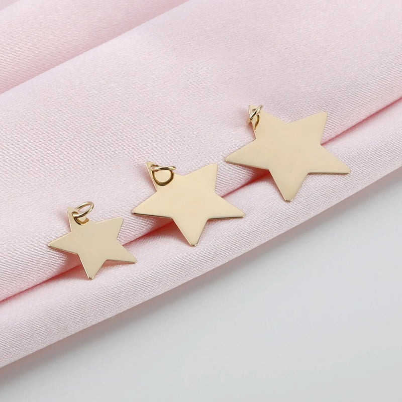 minimalistic star necklace charms in solid gold and various sizes