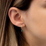 Model wears natural green emerald pear shaped charms with april birthstone diamonds gift for her