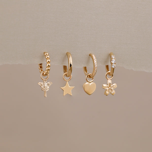 mayfly, star, heart and cherry blossom earring charms on solid gold and diamond hoops