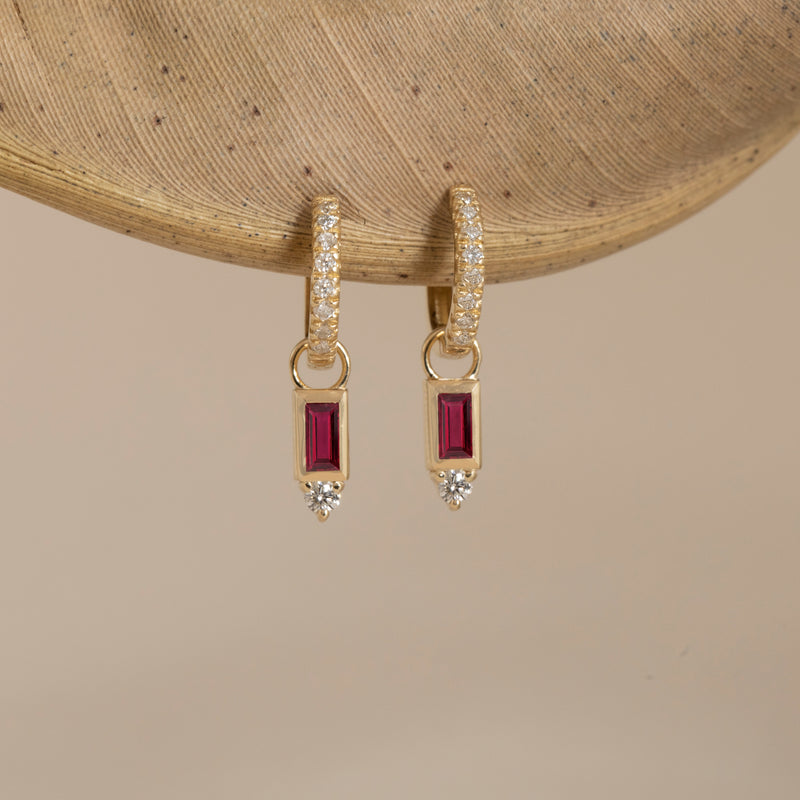 minimalist pair of july birthstone ruby huggie charms with single diamond
