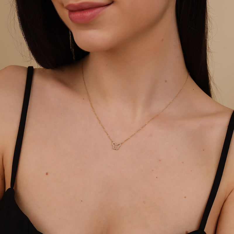 dainty diamond butterfly outline necklace in solid gold