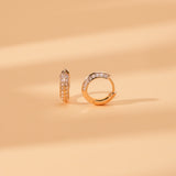 side view of double edged diamond lined hoop huggie in solid 14k gold