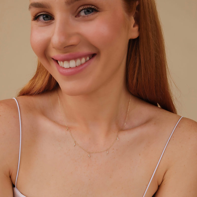 solid gold station lightning bolt charms with paved diamonds necklace