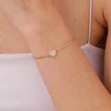 gold Cuban chain bracelet with a freshwater pearl heart charm