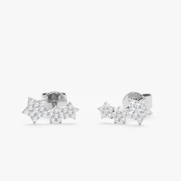 handcrafted pair of solid 14k white gold three star stud earrings with paved diamonds