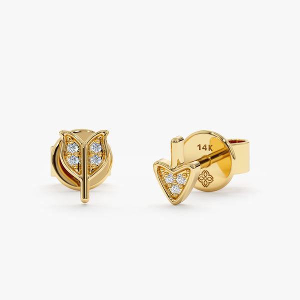 handmade pair of 14k solid gold broken arrow design stud earrings with diamonds