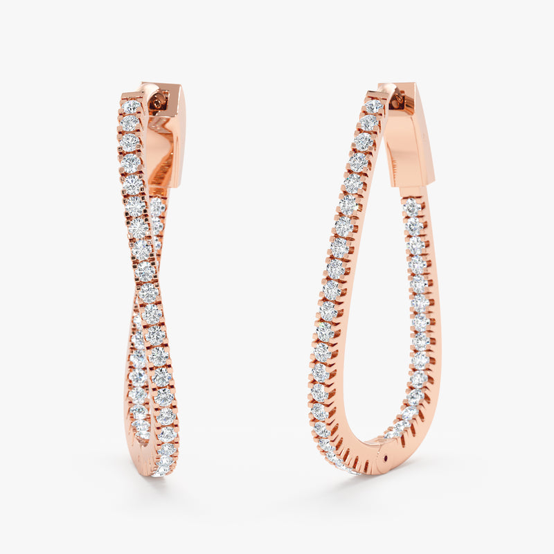 Pair of elegant twisted wavy hoop earrings lined with diamonds in 14k solid rose gold