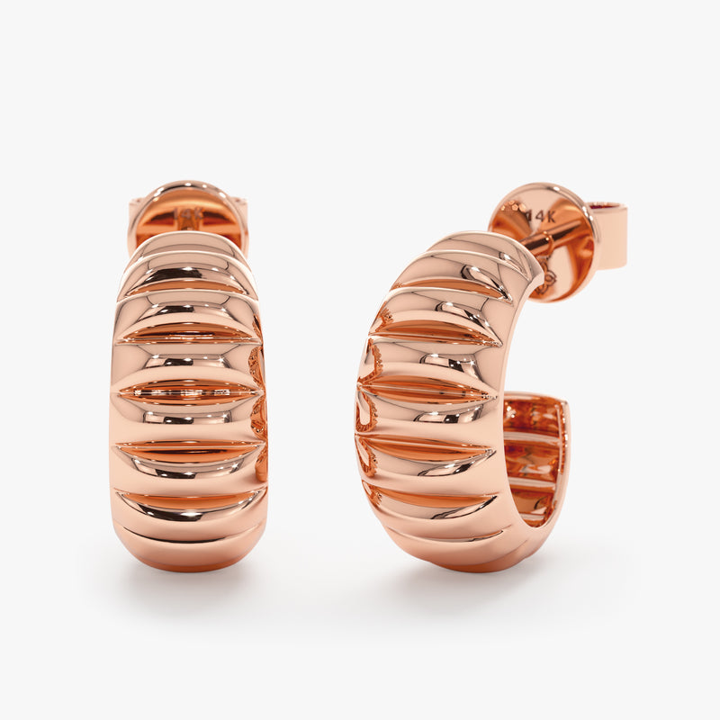 Solid 14k rose gold thick ribbed huggie.